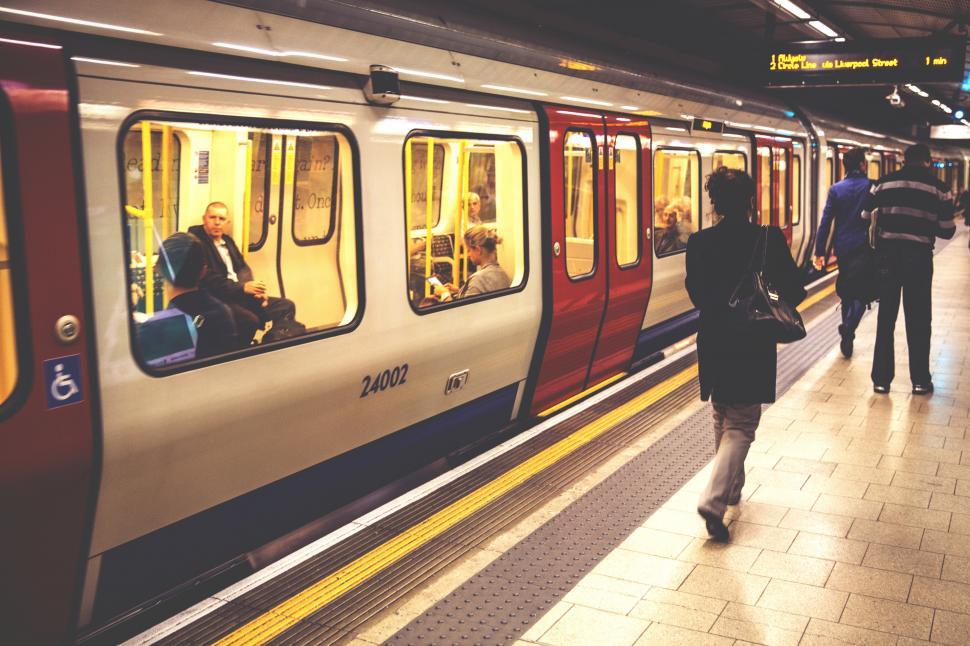 Free Image of A person walking on a train 