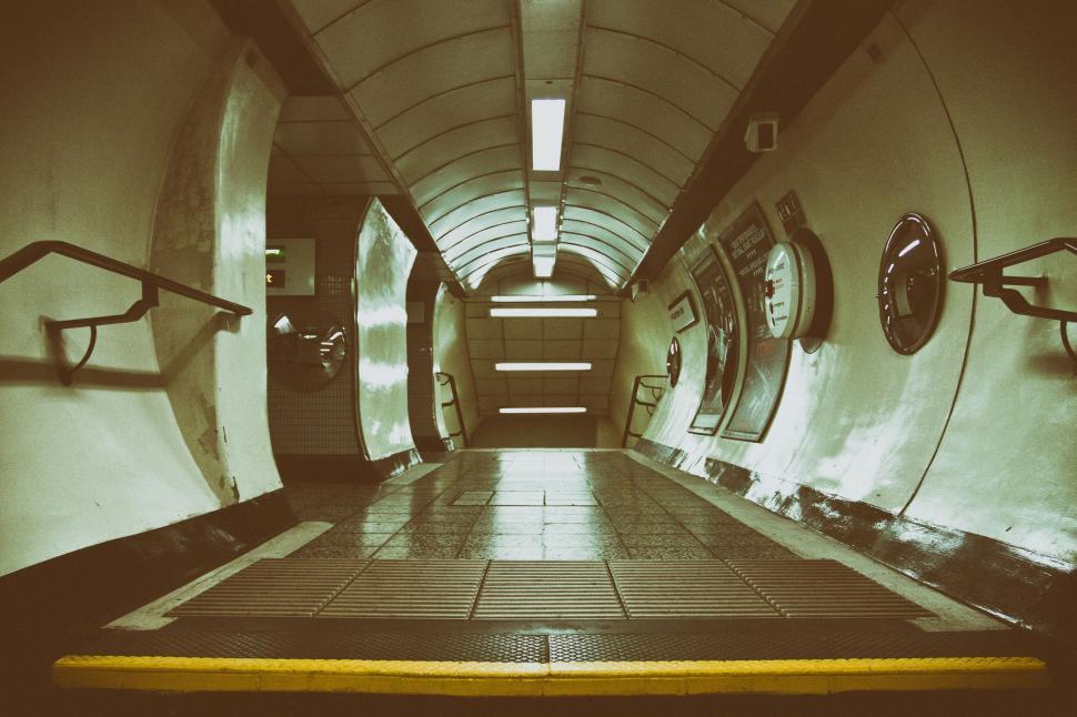 Free Image of A tunnel with circular objects on the wall 