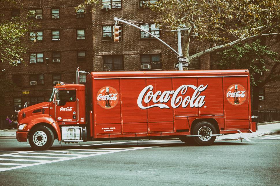 Free Image of A red truck on a street 