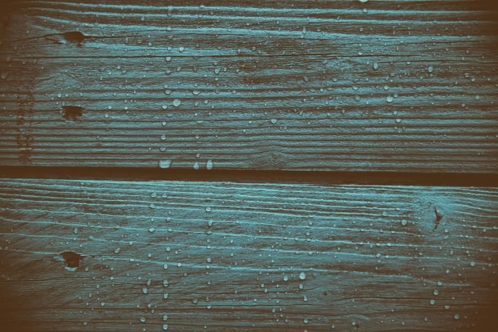 Free Image of Water droplets on a wood surface 