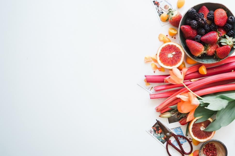 Free Image of A group of fruits and vegetables on a white surface 