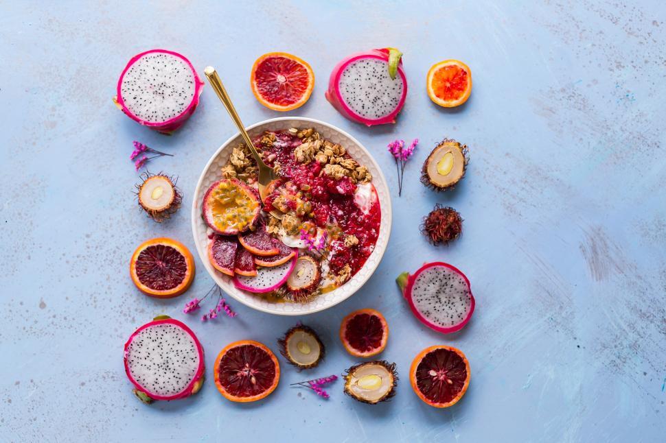 Free Image of A bowl of fruit and a spoon 