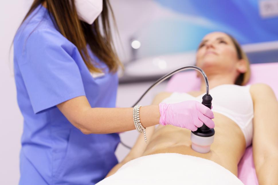 Free Image of Woman receiving anti-cellulite treatment with radiofrequency machine in an aesthetic clinic. 