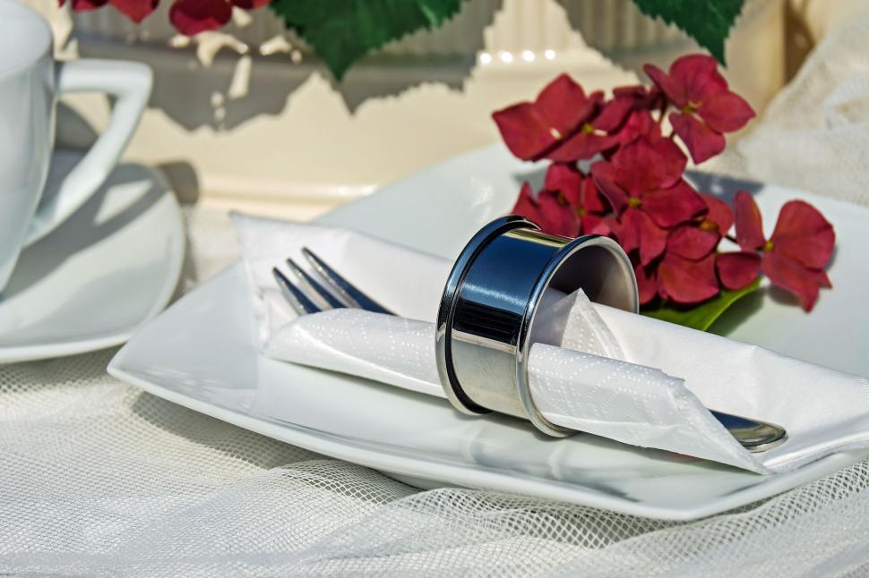 Free Image of A plate with a napkin and fork on it 