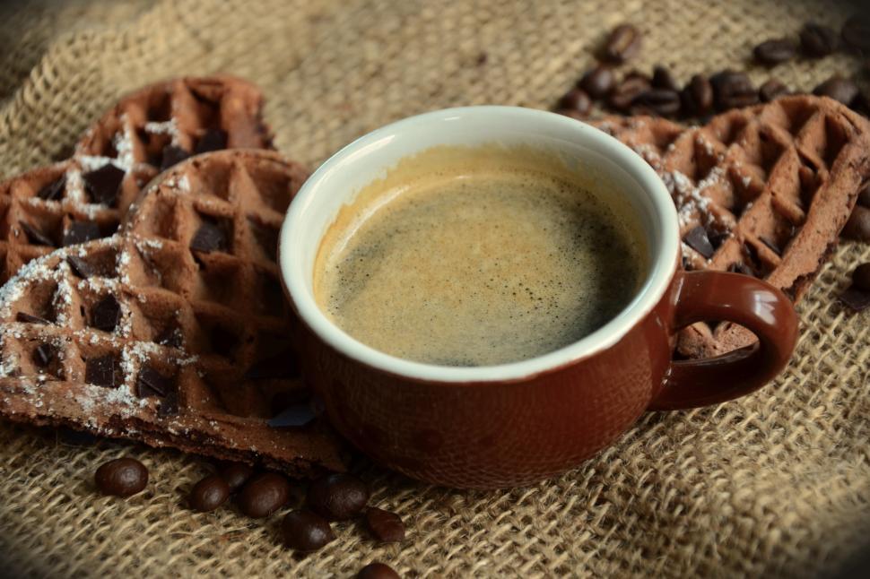 Free Image of A cup of coffee and some cookies 