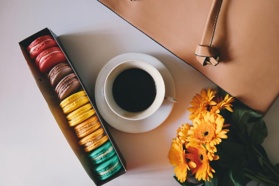 Free Image of A cup of coffee and a box of cookies 
