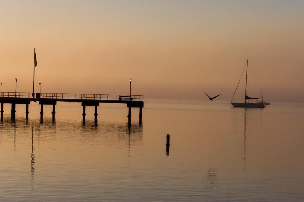 Free Image of Boat Sailing Near Pier 