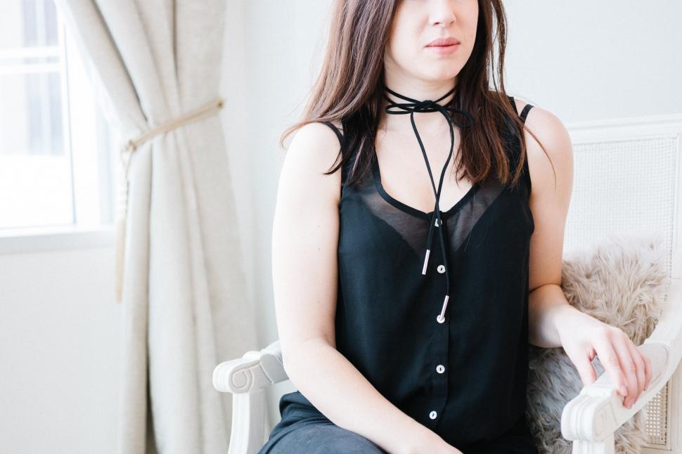 Free Image of A woman sitting in a chair 