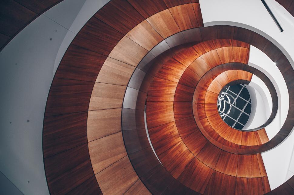 Free Image of A spiral staircase with wood panels 