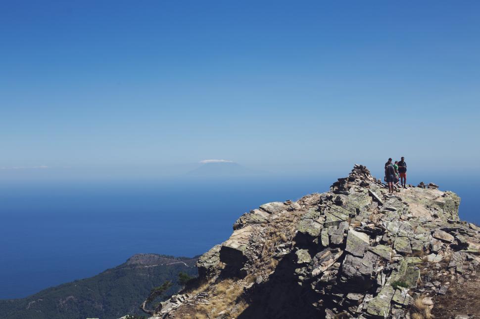 Free Image of People standing on a rocky mountain 