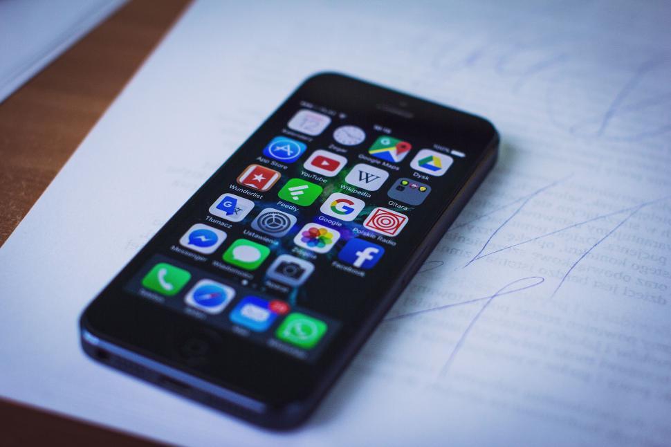 Free Image of A cell phone on a piece of paper 