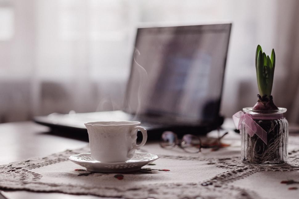 Free Image of A cup of coffee on a table 