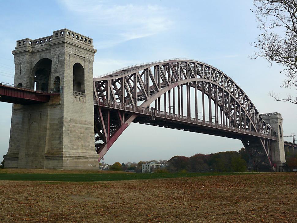 Free Image of Large Bridge Over River Next to Forest 