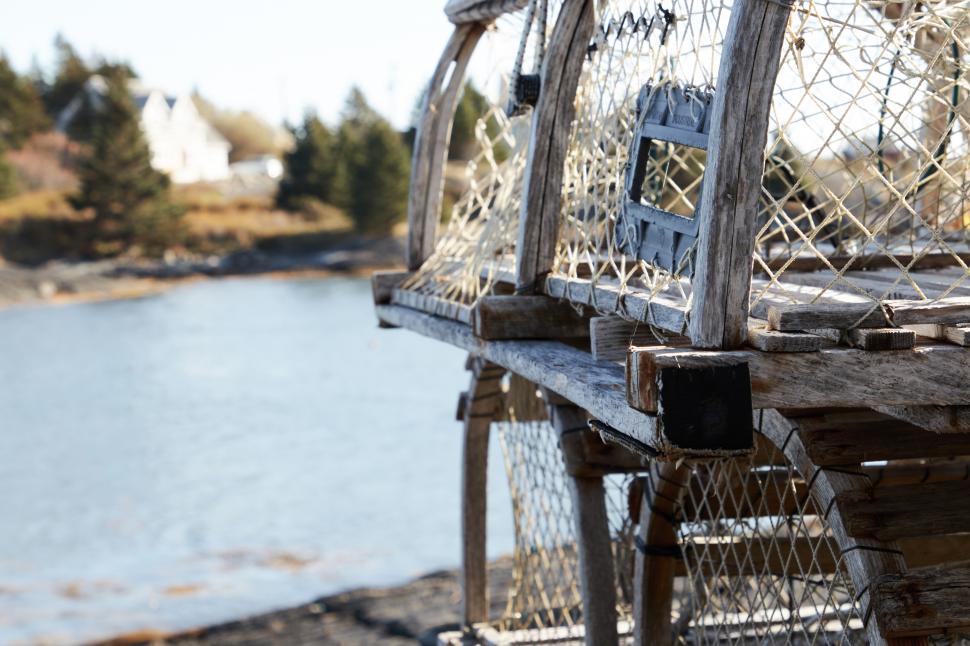 Free Image of A wooden structure with a chain link fence 