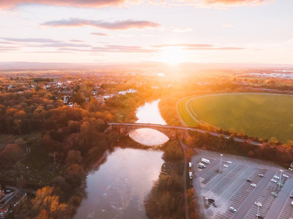 Free Image of A bridge over a river with a parking lot and a parking lot 