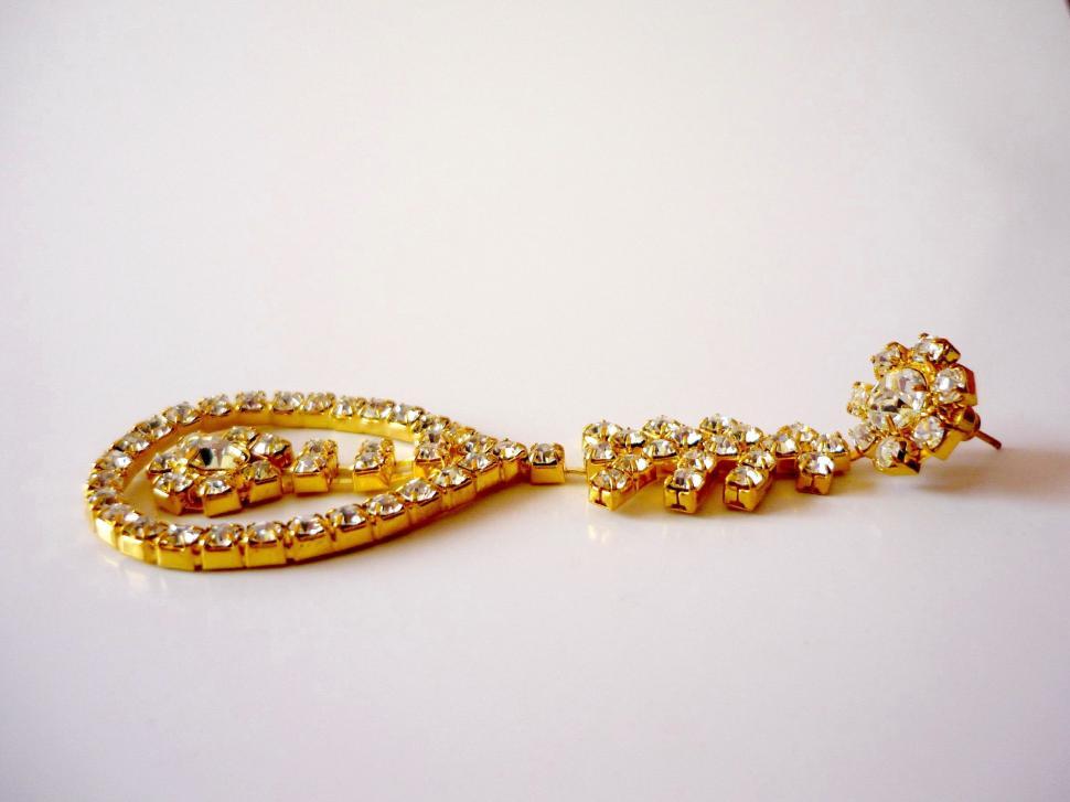 Free Image of Gold Tone Earrings With Clear Stones 