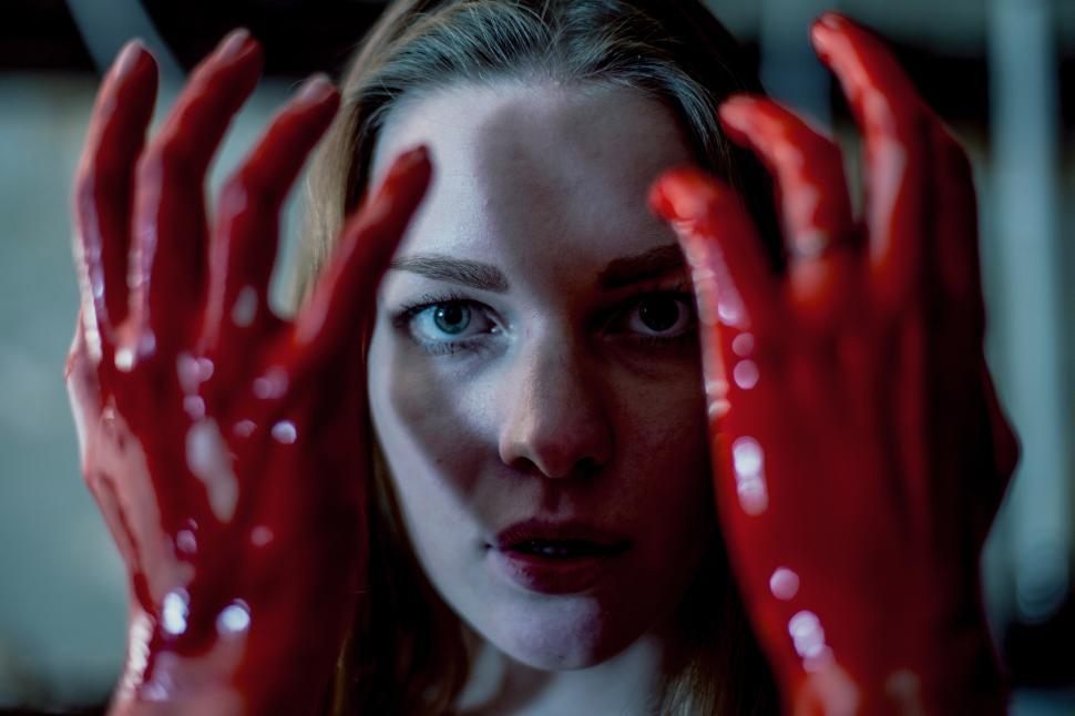 Free Image of A woman with red hands 