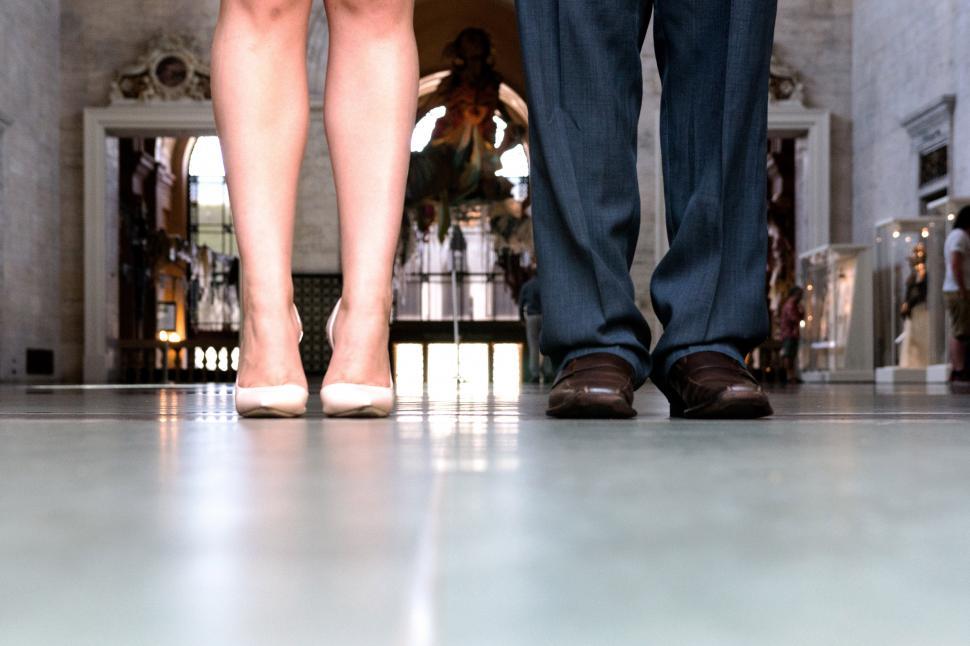 Free Image of A close-up of a man and womans legs 