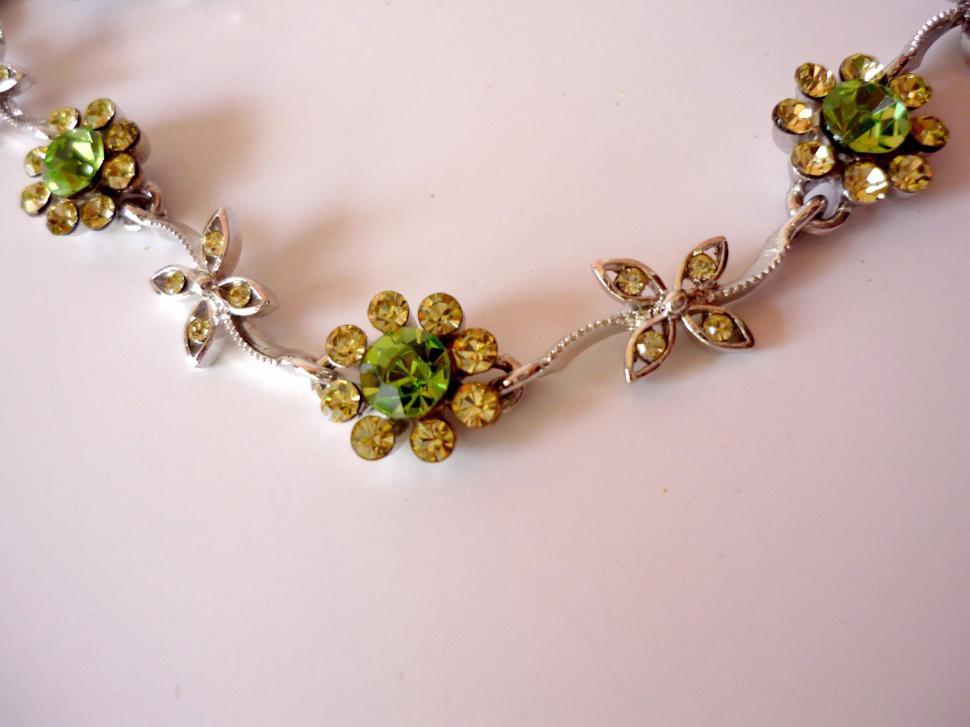 Free Image of Necklace Adorned With Flowers and Leaves 
