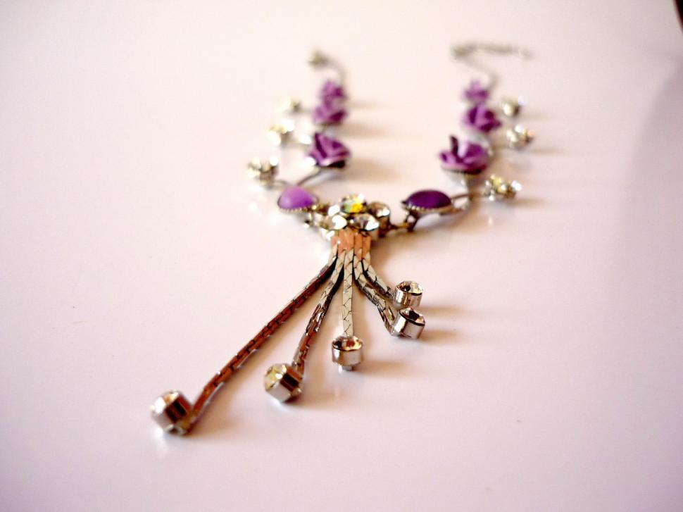 Free Image of Necklace With Multiple Charms Attached 