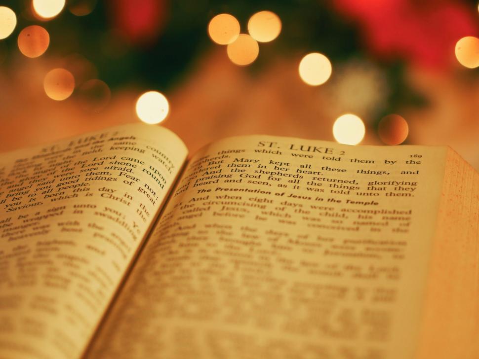 Free Image of An open book with lights in the background 
