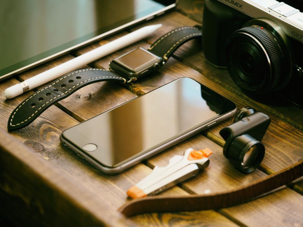Free Image of A cell phone and other objects on a table 