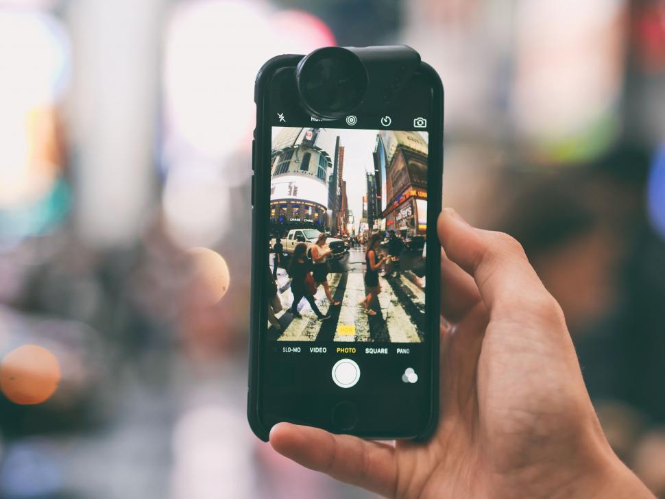 Free Image of A hand holding a cell phone with a camera 