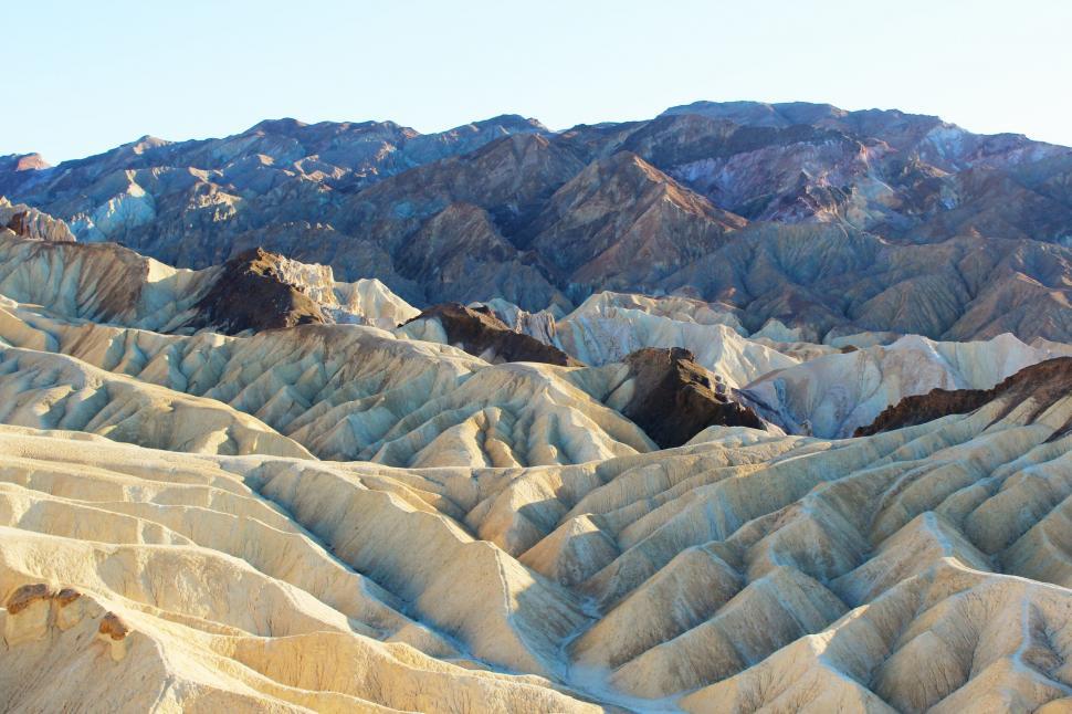 Free Image of A mountain range with a blue sky 