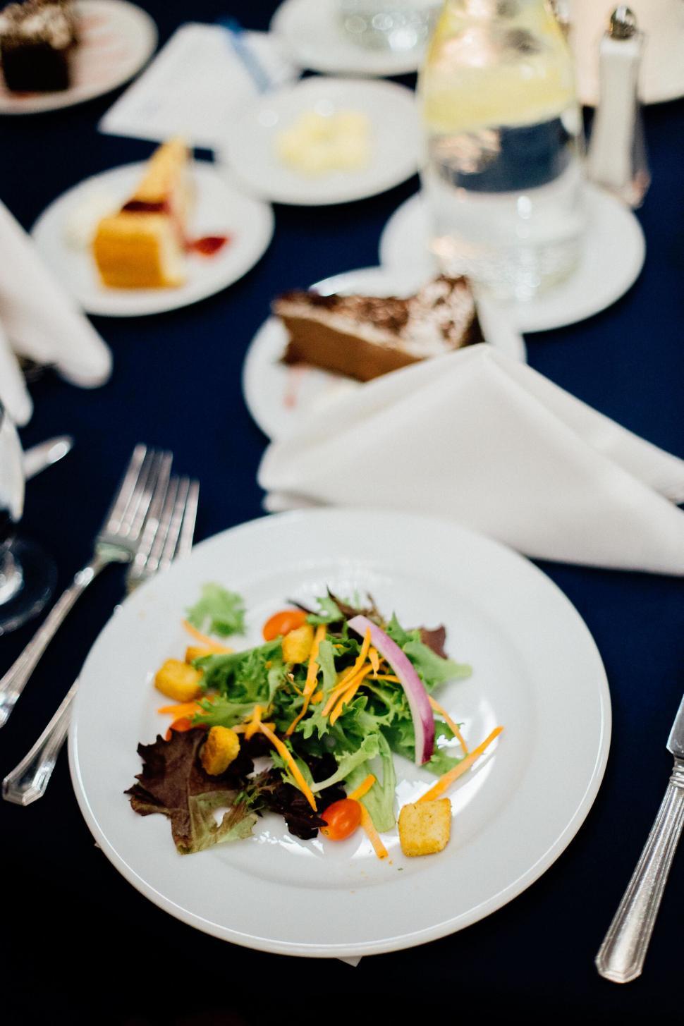Free Image of A plate of salad and cake 