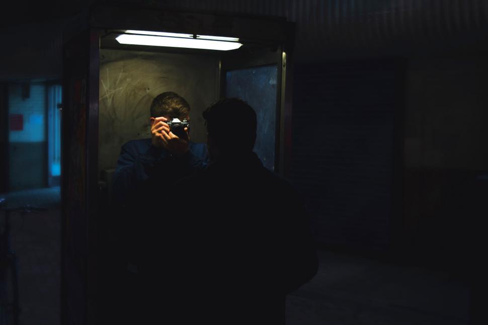 Free Image of A man taking a picture of himself in a mirror 