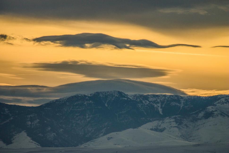 Free Image of A snowy mountains with clouds 