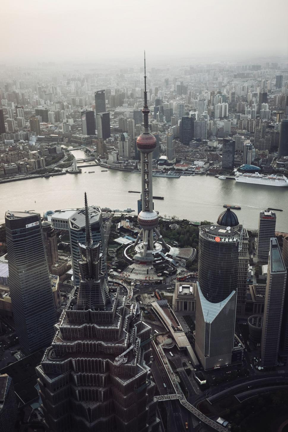 Free Image of A city with a river and a tall tower 