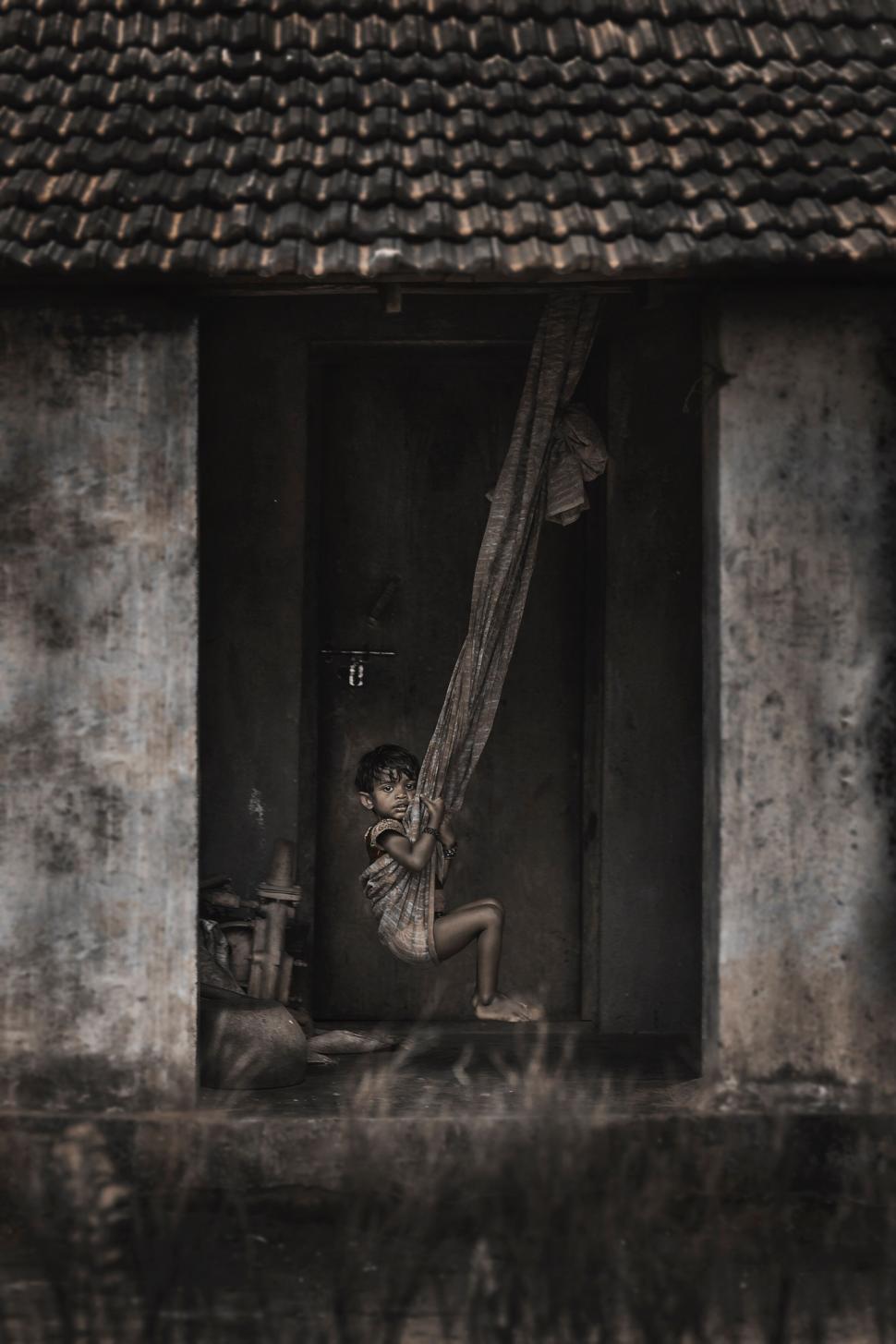Free Image of A child swinging on a net 