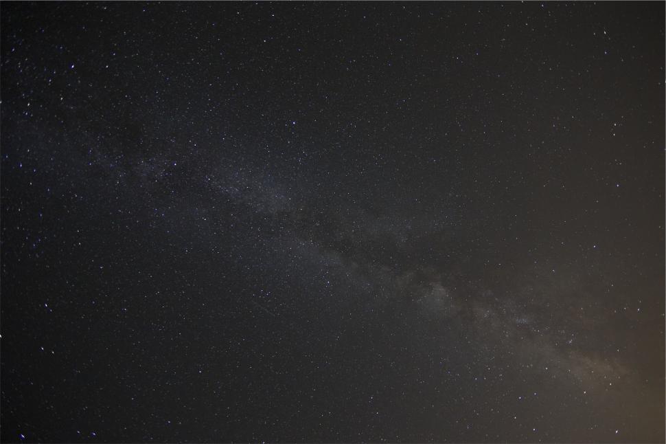 Free Image of A starry sky with a bright light 