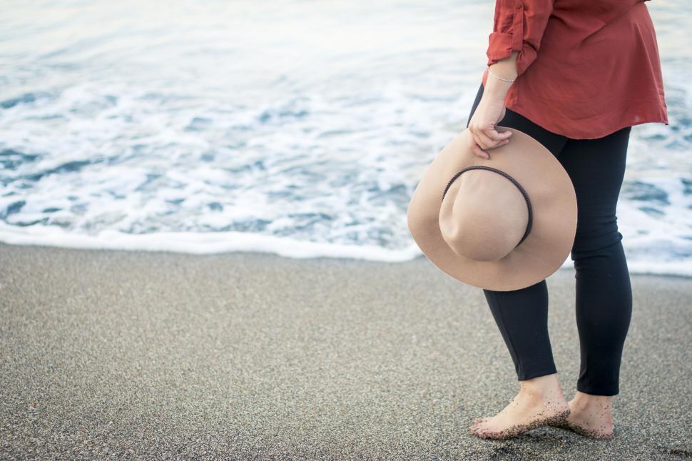Free Image of A person walking on a beach 