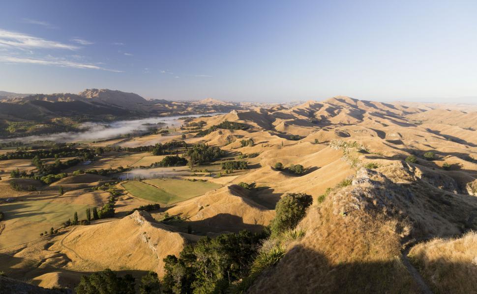 Free Image of A landscape with hills and trees 