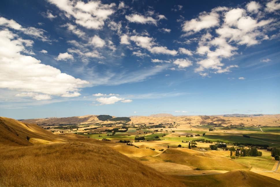 Free Image of A landscape with hills and trees 