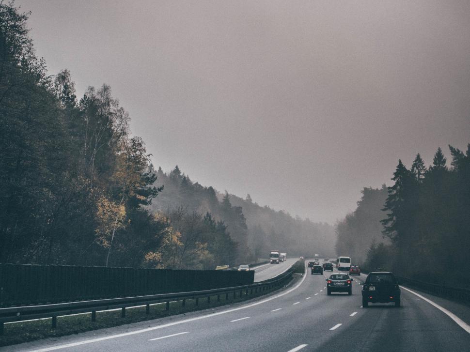 Free Image of A highway with cars on it 