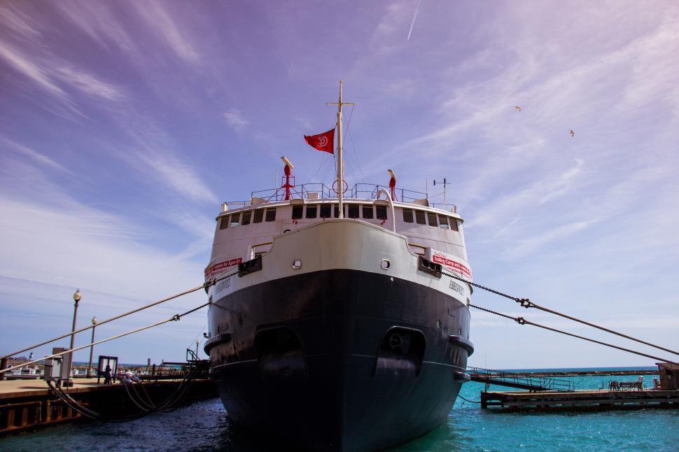 Free Image of A boat docked at a dock 