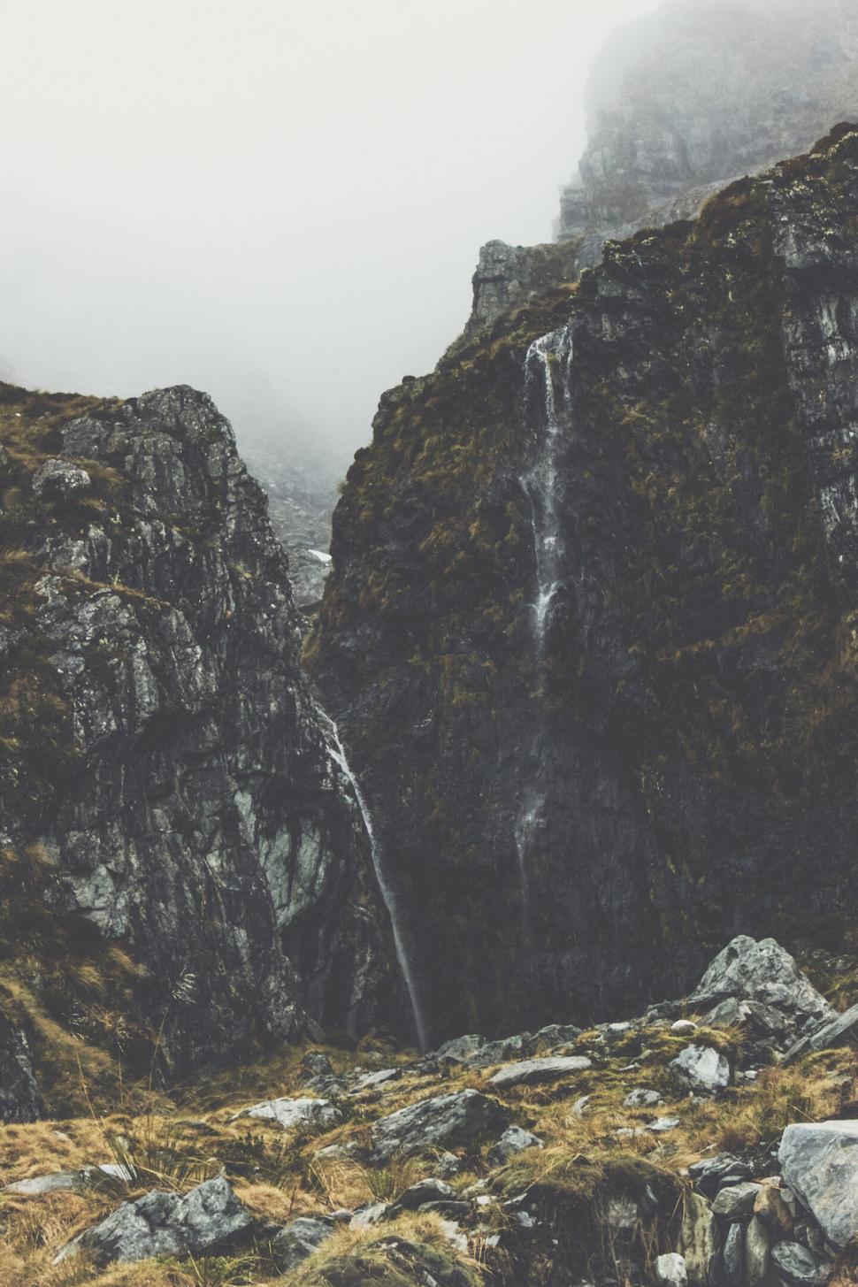 Free Image of A waterfall over a rocky cliff 