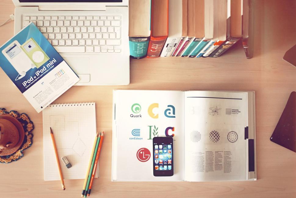 Free Image of A laptop and a phone on a table 