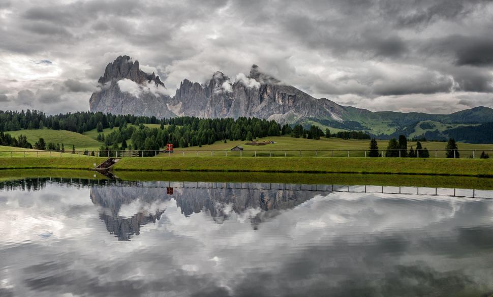 Free Image of A body of water with a mountain in the background 