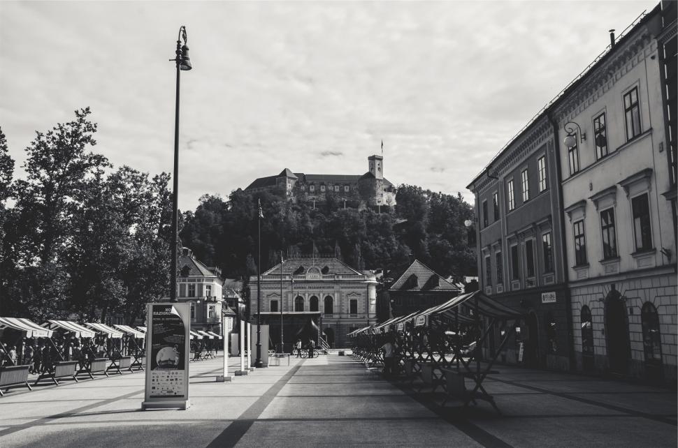 Free Image of A street with chairs and tables on it 