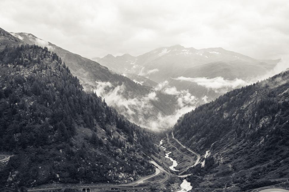 Free Image of A valley with trees and mountains 