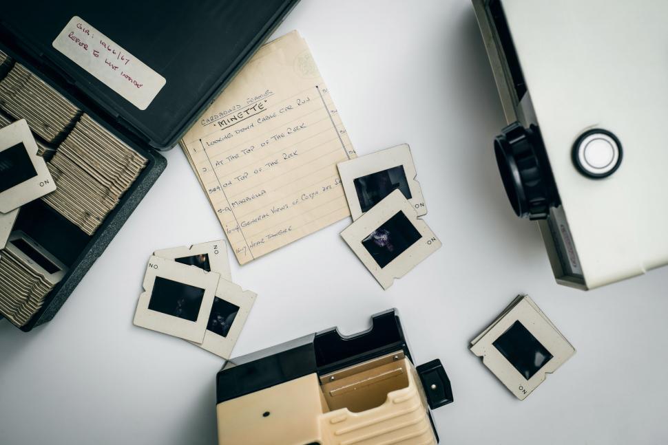 Free Image of Slide slides and a projector on a table 