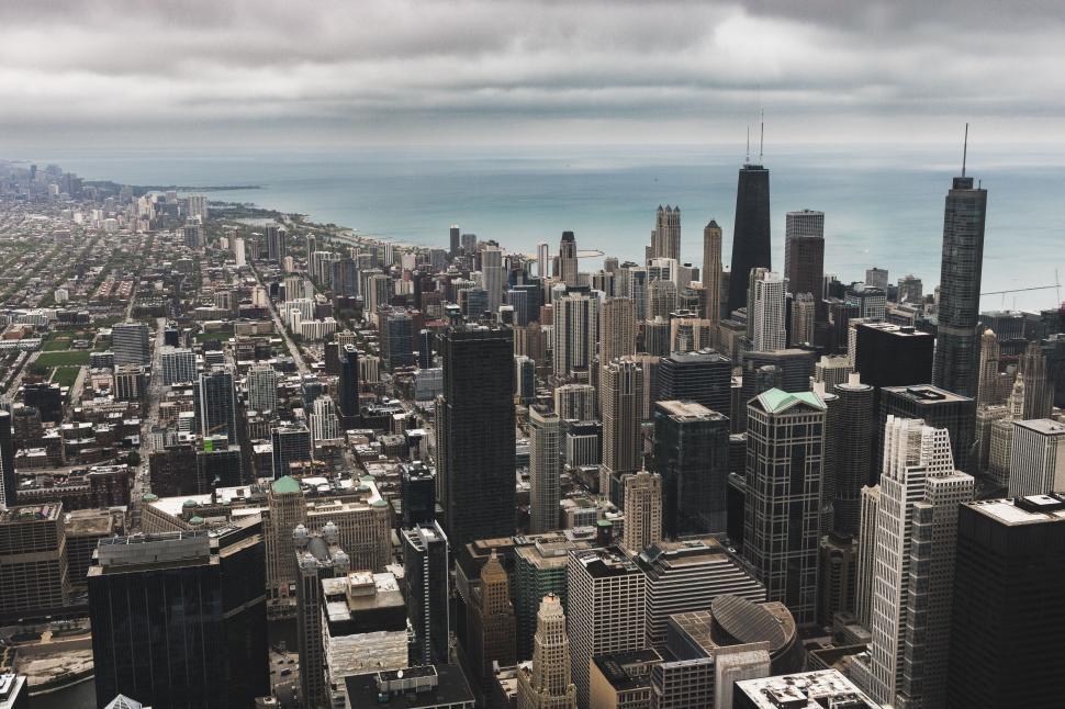 Free Image of A city with tall buildings and a body of water 