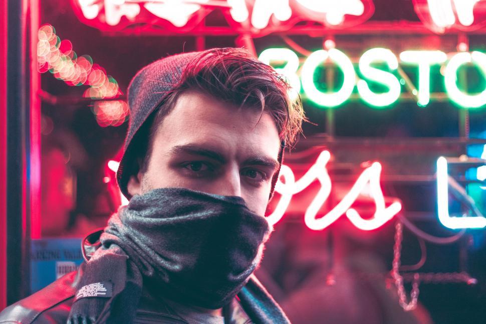 Free Image of A man with a scarf over his face 