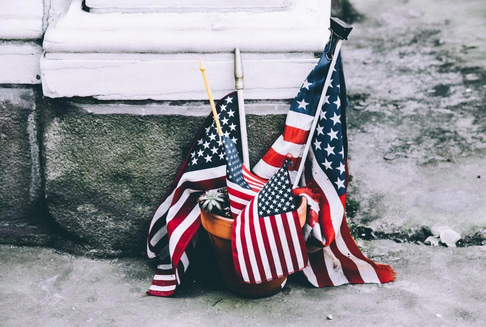 Free Image of A pot with flags on it 
