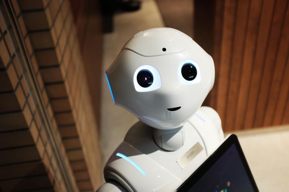 Free Image of A robot with a tablet 