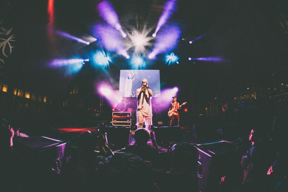 Free Image of A man on a stage with a microphone 